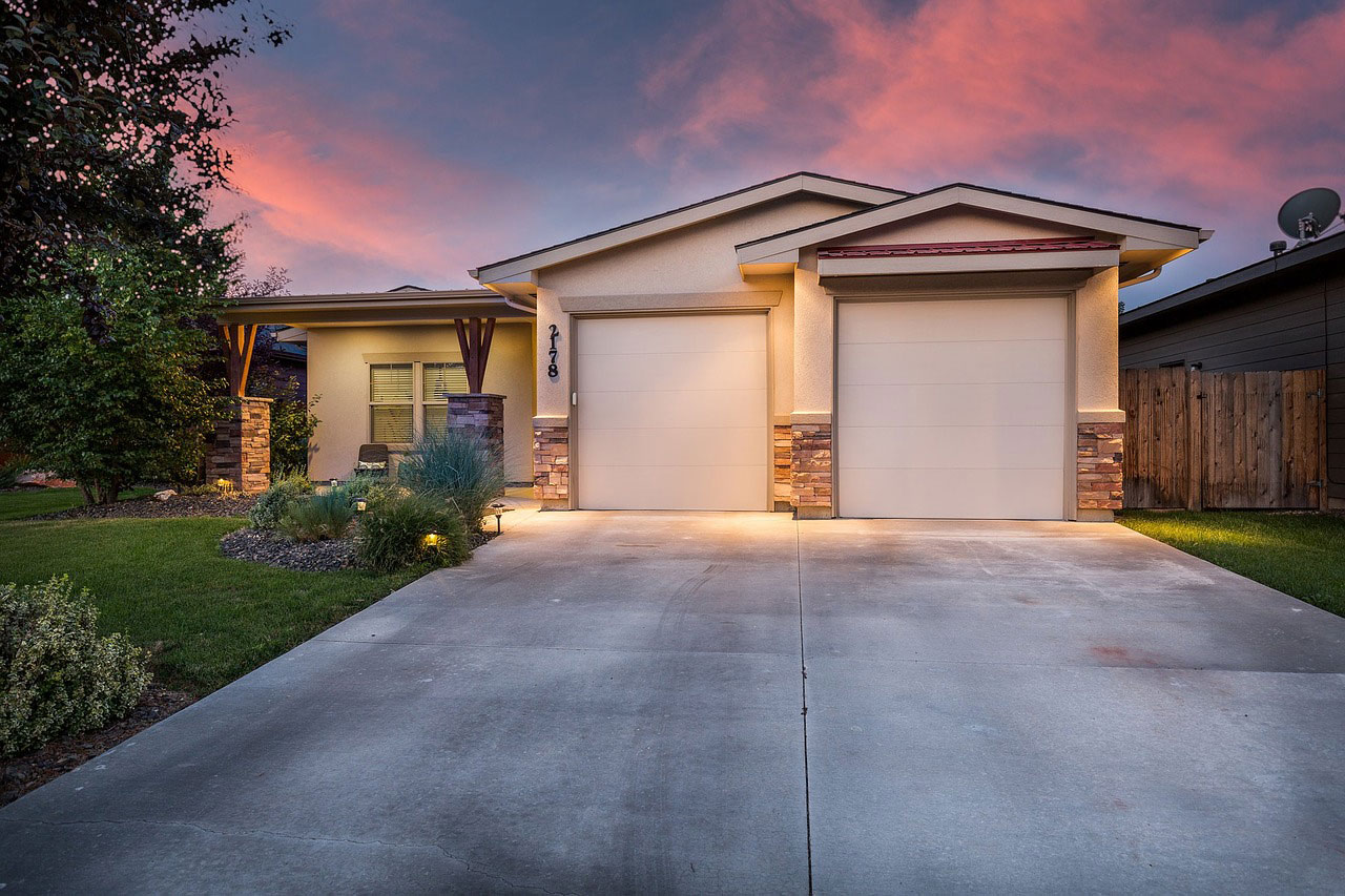 House exterior with a driveway and double garage